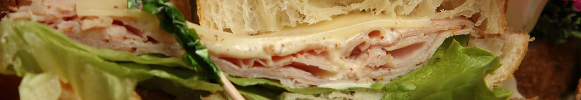 Eating Sandwich Cafe at Howard's Bagels restaurant in Lake Hiawatha, NJ.